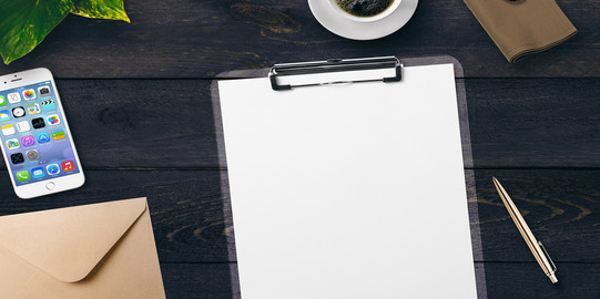 Contact Table with writing pad, pen, cell phone, envelope and coffee cup