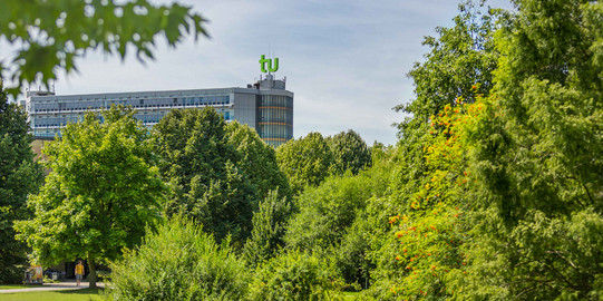 The mathematics building with green trees in the foreground.